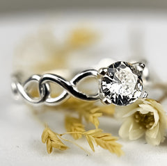 Anel Solitário de Prata 925 Infinito Trançado